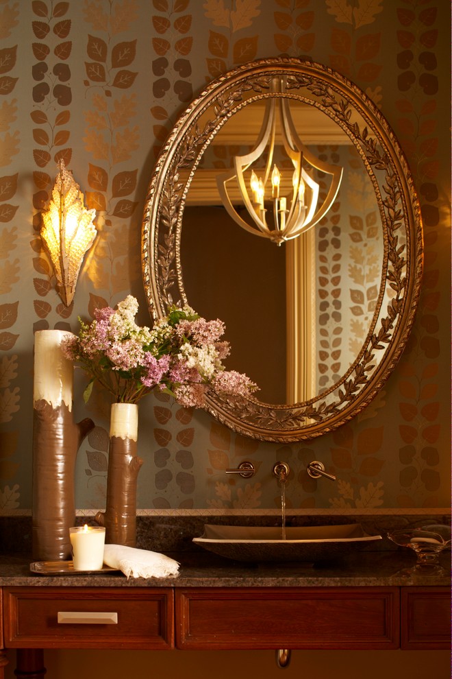 Immagine di un bagno di servizio chic di medie dimensioni con consolle stile comò, ante in legno bruno, pareti multicolore, lavabo a bacinella, top in granito e top marrone