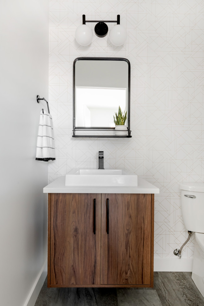 Inspiration for a medium sized midcentury cloakroom in Other with flat-panel cabinets, medium wood cabinets, a two-piece toilet, white walls, vinyl flooring, a vessel sink, engineered stone worktops, grey floors and white worktops.