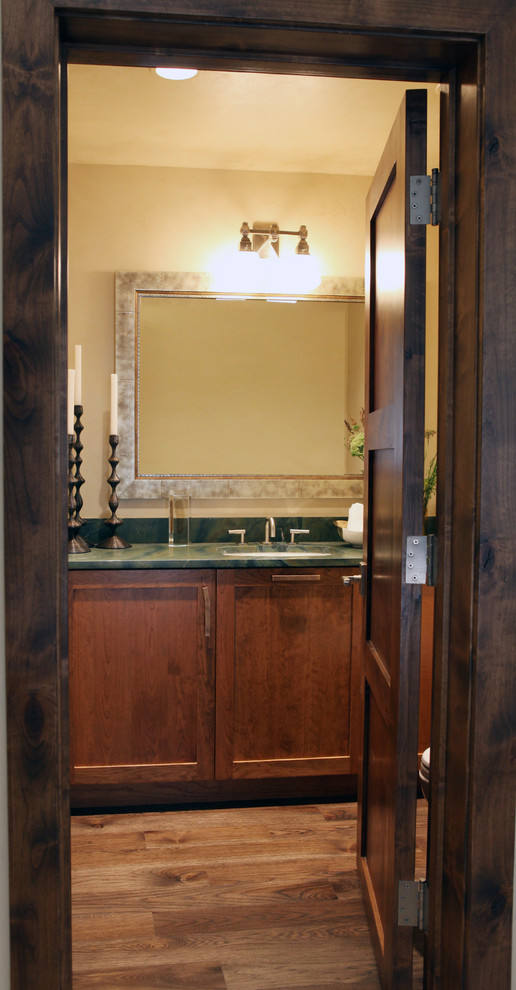 Photo of a traditional cloakroom in Denver with a submerged sink, shaker cabinets, medium wood cabinets, granite worktops and a one-piece toilet.