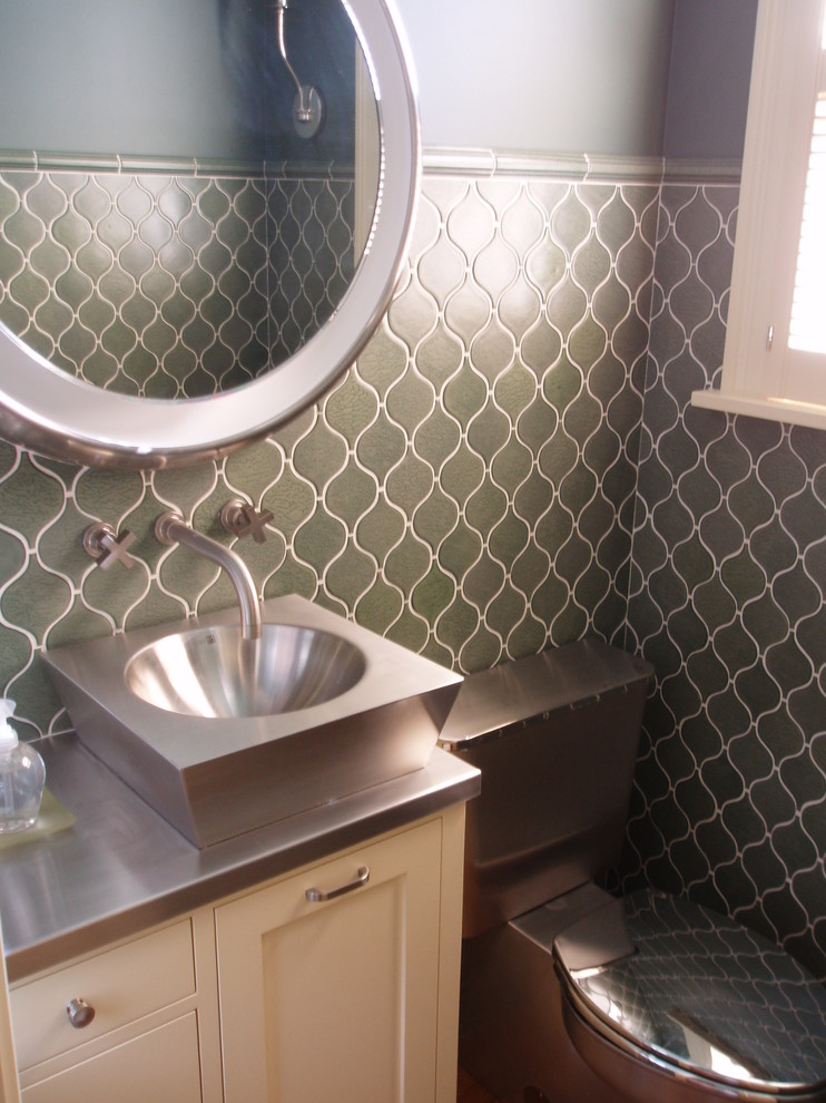 Inspiration for a classic cloakroom in Minneapolis with a vessel sink, white cabinets, stainless steel worktops, a one-piece toilet, green tiles and ceramic tiles.