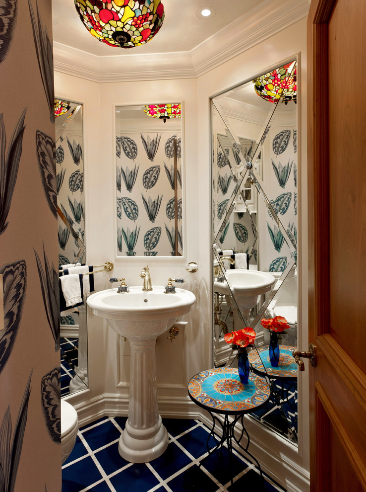 Tuscan powder room photo in Milwaukee with a pedestal sink