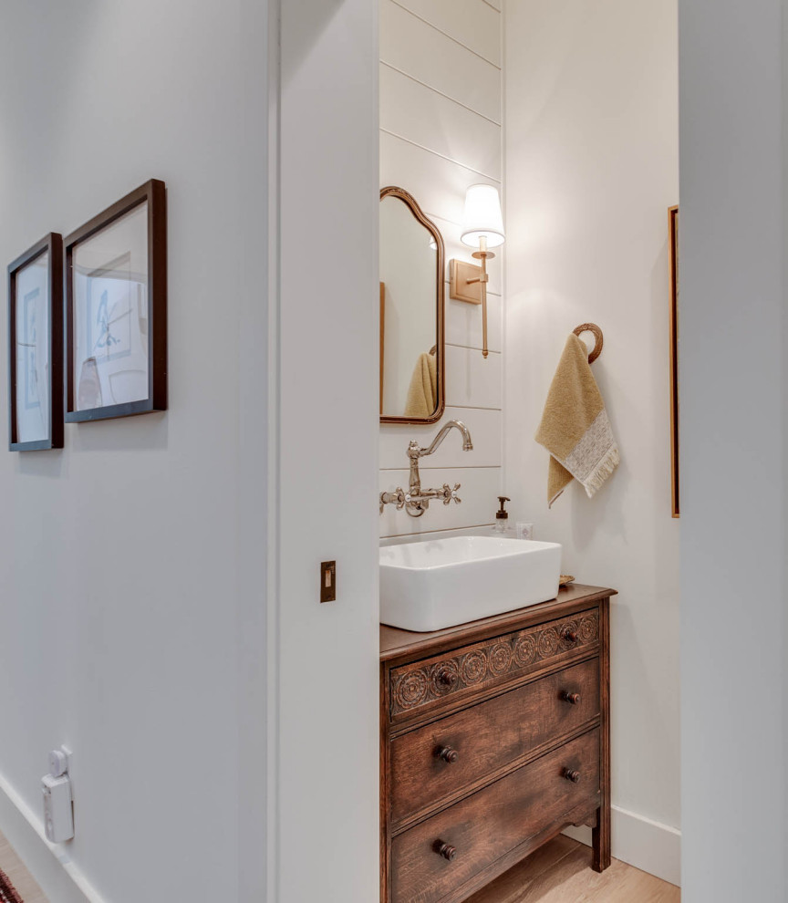 Inspiration for a farmhouse powder room remodel in Other