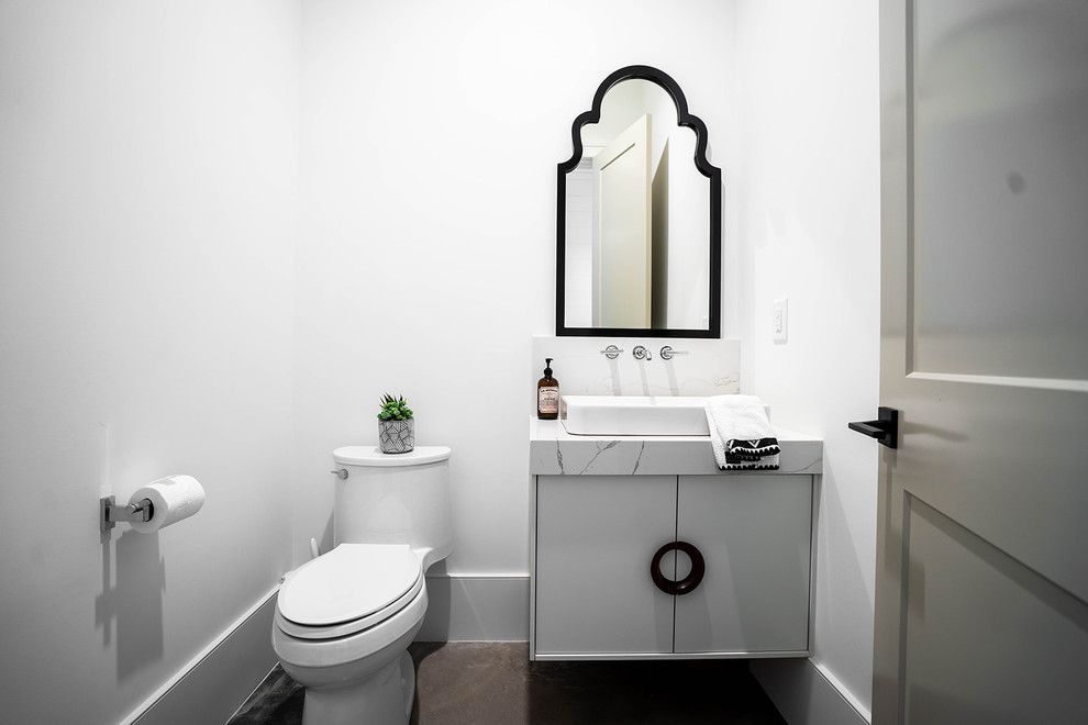 Photo of a small modern cloakroom in Atlanta with flat-panel cabinets, white cabinets, a one-piece toilet, white walls, a vessel sink, quartz worktops and white worktops.