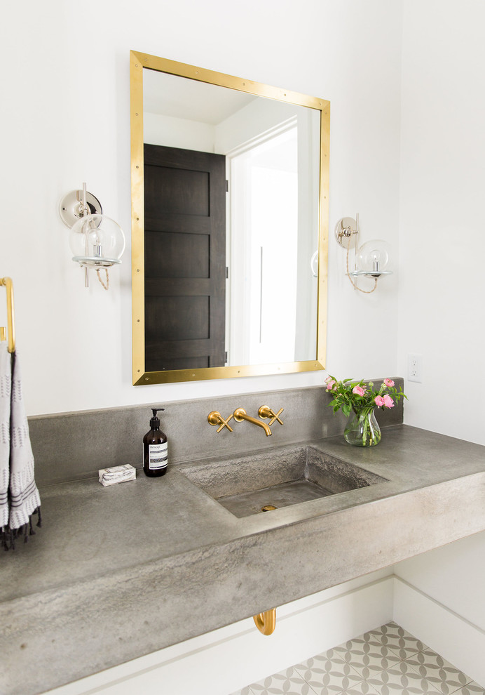 Powder room - transitional multicolored floor powder room idea in Salt Lake City with white walls, concrete countertops, an integrated sink and gray countertops