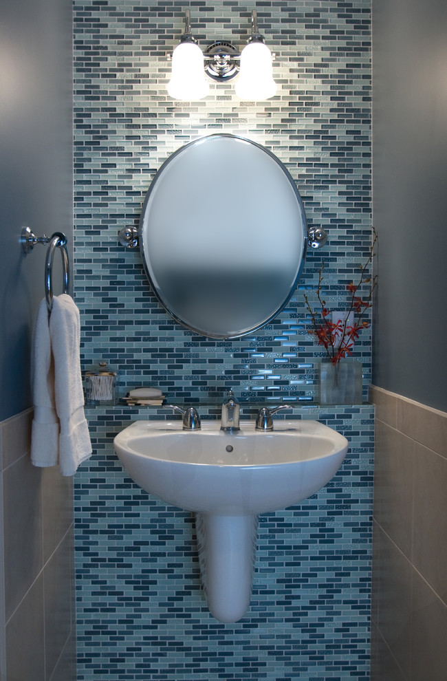Photo of a contemporary cloakroom in Other with mosaic tiles.