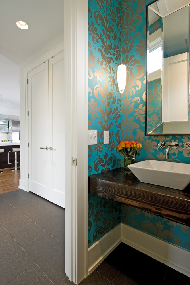 Trendy powder room photo in Minneapolis with a vessel sink and brown countertops