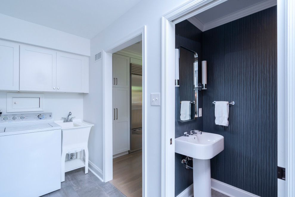This is an example of a small modern cloakroom in Philadelphia with white cabinets, blue walls, ceramic flooring, a pedestal sink, grey floors, white worktops, a coffered ceiling and wallpapered walls.