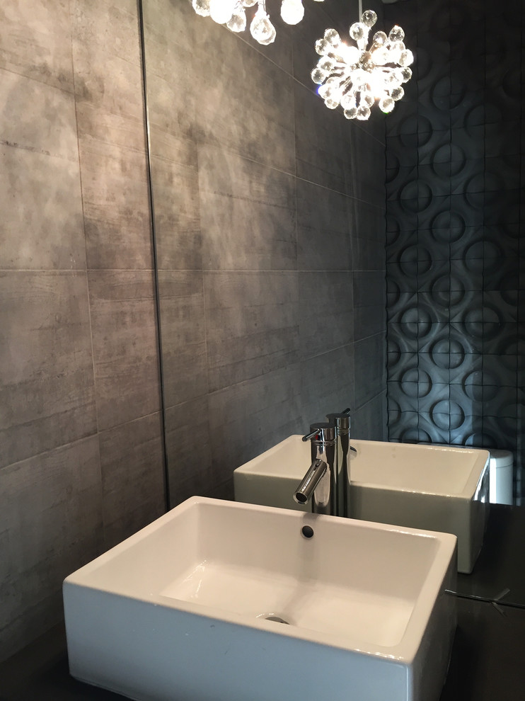 This is an example of a modern cloakroom in San Francisco with flat-panel cabinets, white cabinets, grey tiles, cement tiles, a vessel sink and engineered stone worktops.