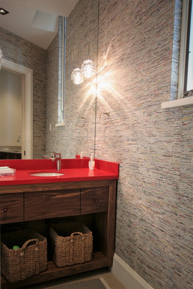 Small contemporary cloakroom in Other with open cabinets, medium wood cabinets, a one-piece toilet, a submerged sink, solid surface worktops, grey walls and red worktops.