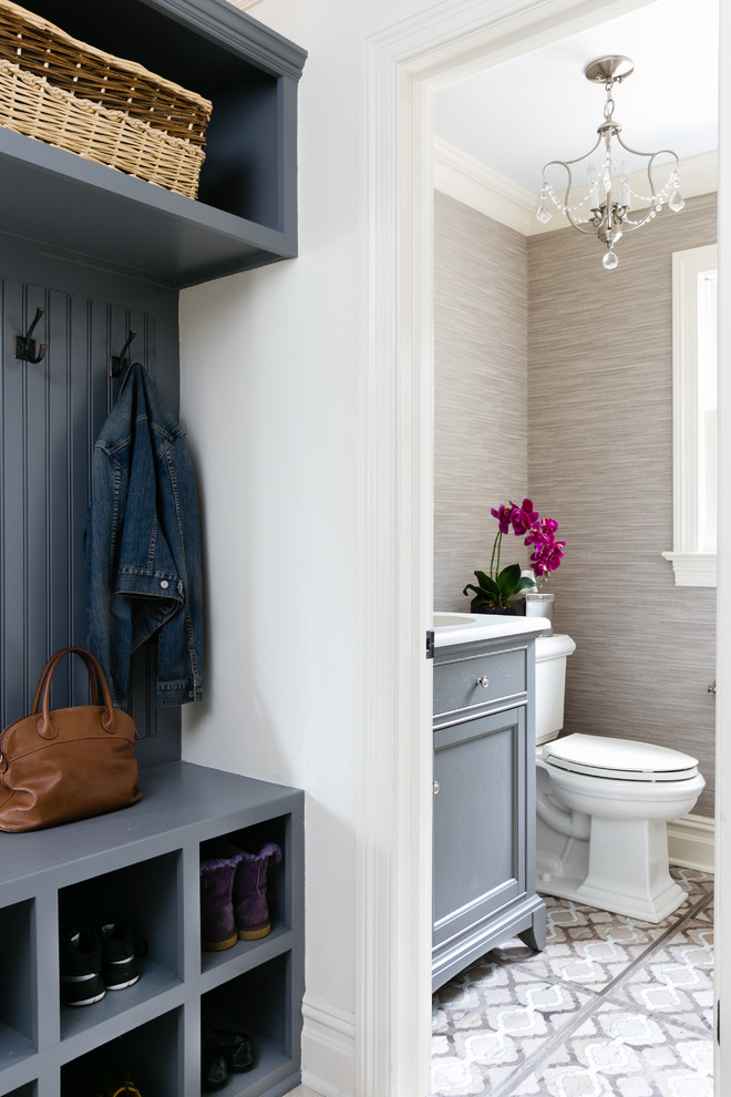 Inspiration for a small transitional beige tile porcelain tile powder room remodel in Newark with recessed-panel cabinets, gray cabinets, a two-piece toilet, beige walls, an undermount sink and quartzite countertops