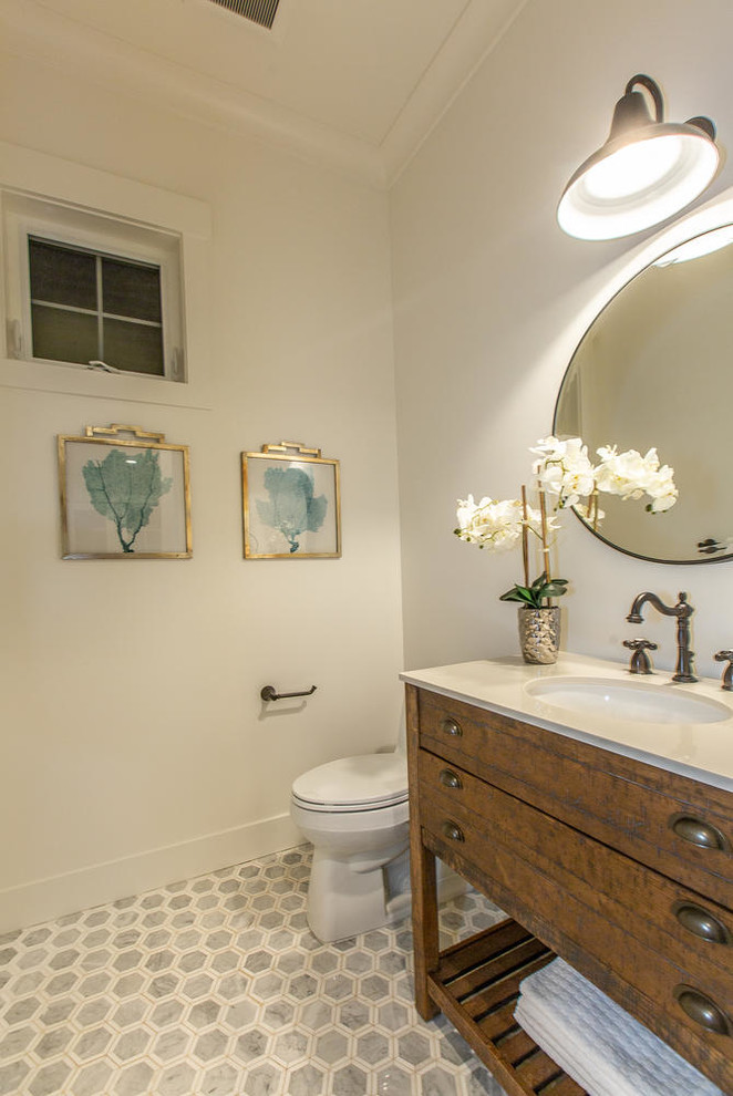 Inspiration for a mid-sized farmhouse marble floor and gray floor powder room remodel in San Francisco with flat-panel cabinets, dark wood cabinets, a two-piece toilet, white walls, an undermount sink, quartz countertops and beige countertops