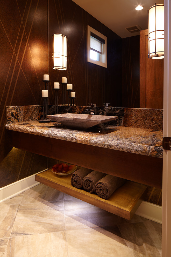Idée de décoration pour un grand WC et toilettes tradition en bois brun avec une vasque, un placard à porte plane, un plan de toilette en granite, un carrelage marron, un mur marron, un sol en carrelage de porcelaine et un plan de toilette marron.