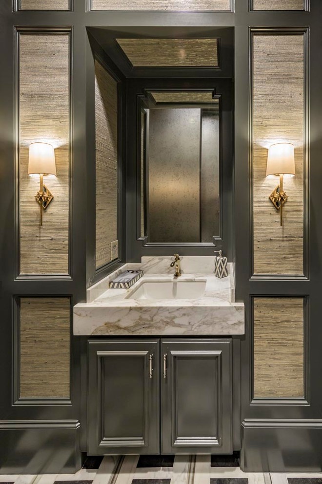 Inspiration for a mid-sized transitional beige floor powder room remodel in Dallas with recessed-panel cabinets, black cabinets, gray walls and an undermount sink