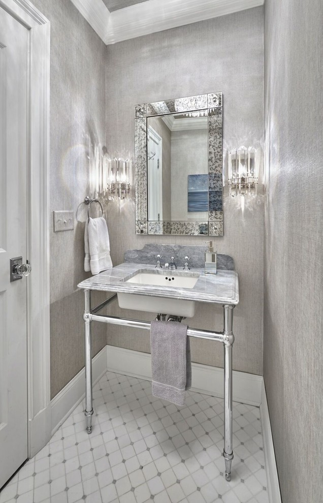 На фото: туалет среднего размера в классическом стиле с серой плиткой, серыми стенами, мраморным полом, врезной раковиной, мраморной столешницей и белым полом с