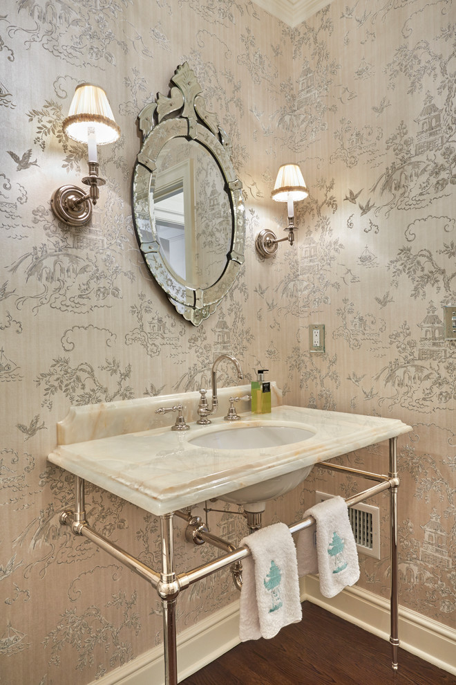 Eclectic powder room photo in New York with onyx countertops
