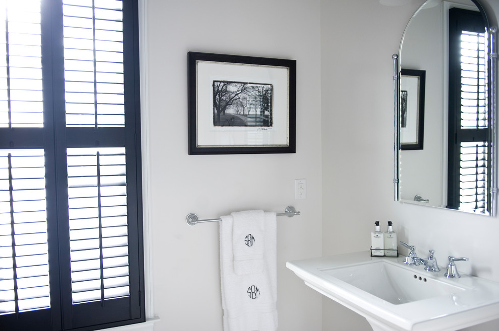 Small classic cloakroom in Other with a pedestal sink, white walls and solid surface worktops.