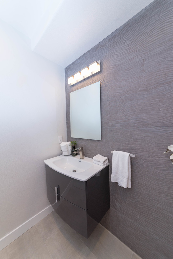 Example of a small trendy beige floor powder room design in San Francisco with flat-panel cabinets, brown cabinets, brown walls, an integrated sink and quartz countertops