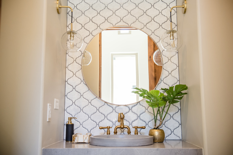 Example of a mid-sized eclectic white tile and ceramic tile medium tone wood floor powder room design in Phoenix with gray walls, a vessel sink, quartz countertops and gray countertops