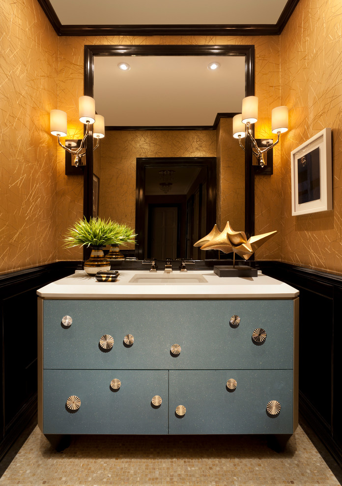 Inspiration for a medium sized traditional cloakroom in New York with freestanding cabinets, blue cabinets, black walls, mosaic tile flooring, an integrated sink, solid surface worktops and beige floors.