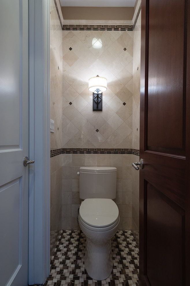 Example of a small transitional beige tile and ceramic tile mosaic tile floor powder room design in New York with a two-piece toilet and beige walls