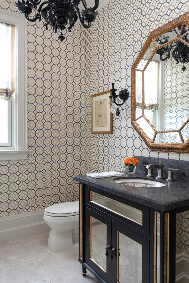 Idées déco pour un WC et toilettes classique avec un lavabo encastré, un placard en trompe-l'oeil, un mur multicolore et un plan de toilette noir.