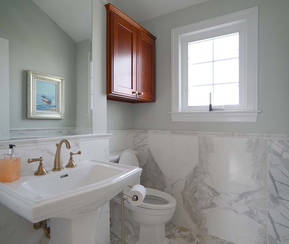 This is an example of a medium sized classic cloakroom in Philadelphia with a two-piece toilet, grey tiles, marble tiles, grey walls, marble flooring, a pedestal sink, multi-coloured floors and grey worktops.