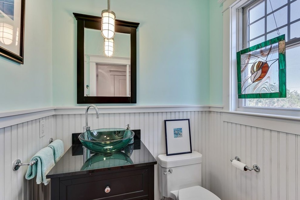 Inspiration for a small craftsman powder room remodel in New York with recessed-panel cabinets, black cabinets, a two-piece toilet, green walls, a vessel sink and quartz countertops