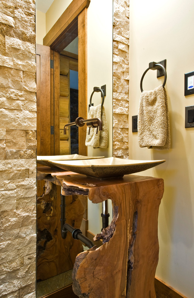 This is an example of a rustic cloakroom in Calgary with a vessel sink.