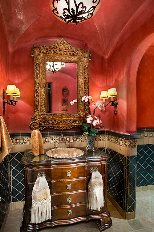 На фото: туалет в классическом стиле с фасадами островного типа, красными стенами и накладной раковиной