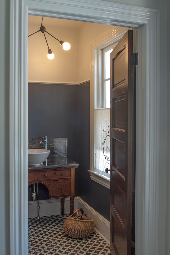 Example of a mid-sized transitional ceramic tile powder room design in New York with a vessel sink, medium tone wood cabinets and blue walls