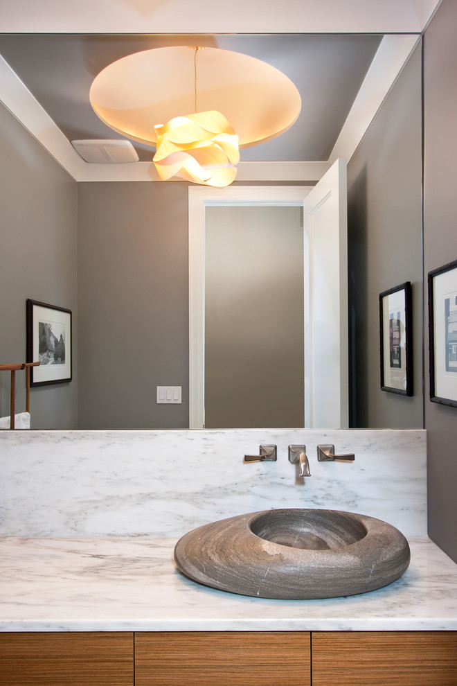 Design ideas for a contemporary cloakroom in Chicago with a vessel sink, marble worktops and marble tiles.
