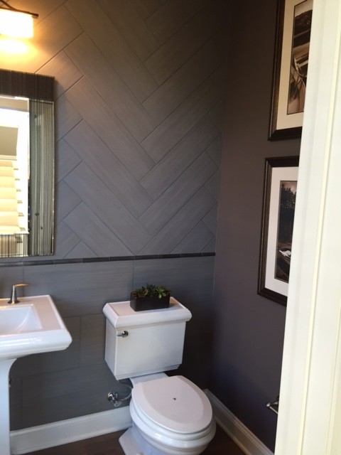 Small classic cloakroom in New York with a two-piece toilet, grey tiles, ceramic tiles, purple walls and a pedestal sink.