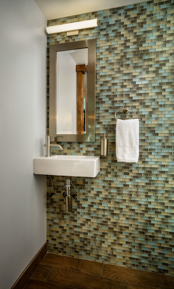 Inspiration for a small contemporary cloakroom in Portland with multi-coloured tiles, mosaic tiles, grey walls, medium hardwood flooring and a wall-mounted sink.