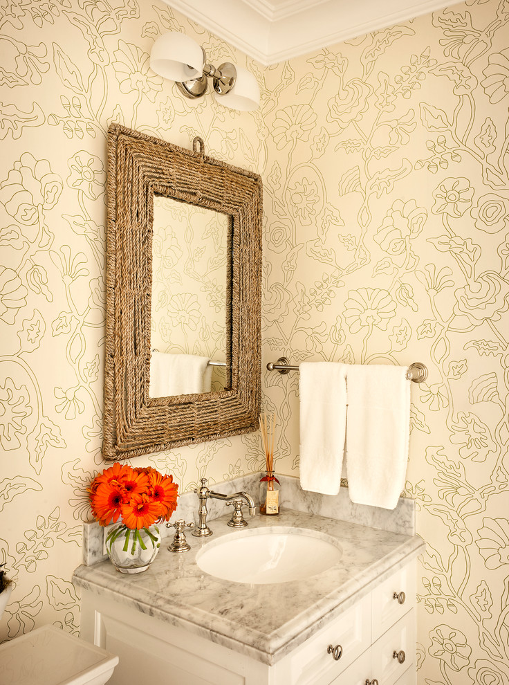 Photo of a traditional cloakroom in Los Angeles with a submerged sink and beige walls.