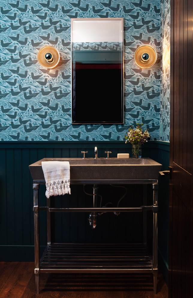 Example of a transitional powder room design in San Francisco with a console sink and multicolored walls