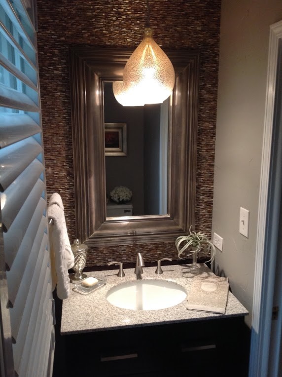 Small transitional brown tile and stone tile powder room photo in Chicago with gray walls, an undermount sink and terrazzo countertops