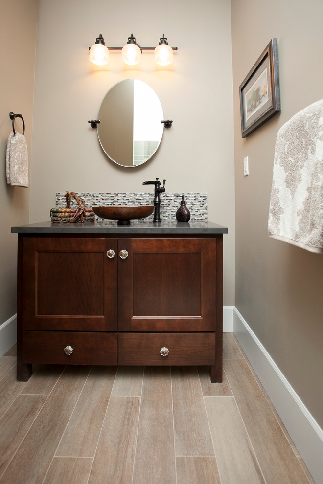 Inspiration for a medium sized classic cloakroom in Portland with a vessel sink, dark wood cabinets, engineered stone worktops, porcelain flooring, mosaic tiles and recessed-panel cabinets.