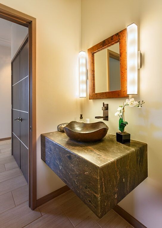 Design ideas for a large modern cloakroom in Other with porcelain flooring and granite worktops.