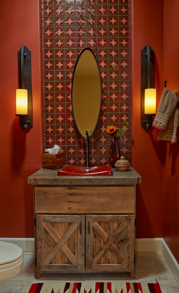 Photo of a small rustic cloakroom in Los Angeles with a vessel sink, freestanding cabinets, medium wood cabinets, quartz worktops, multi-coloured tiles, ceramic tiles, red walls and ceramic flooring.