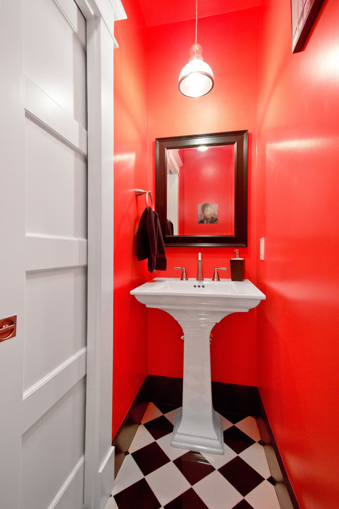 Kleine Urige Gästetoilette mit Sockelwaschbecken, Keramikfliesen, Keramikboden, buntem Boden, weißer Waschtischplatte, orangen Fliesen und oranger Wandfarbe in San Francisco