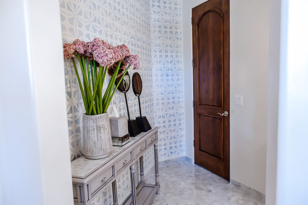 This is an example of a large traditional cloakroom in Phoenix with a pedestal sink, a two-piece toilet and white tiles.