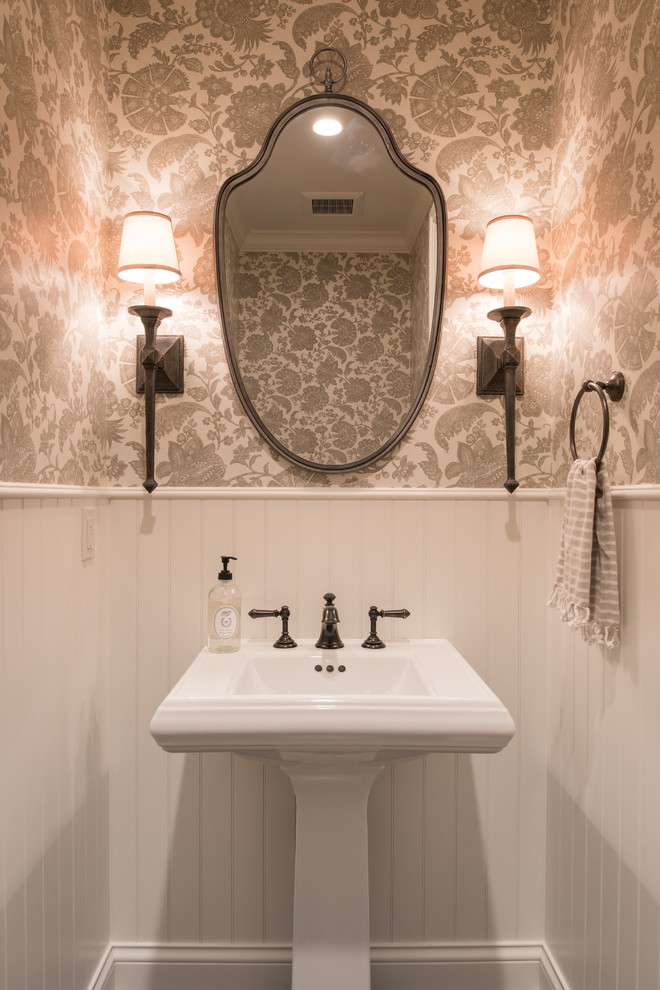 Photo of a medium sized traditional cloakroom in Minneapolis with open cabinets, beige walls, a pedestal sink and solid surface worktops.