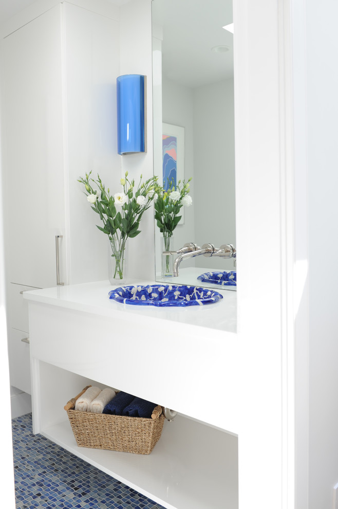 Inspiration for a small contemporary mosaic tile floor powder room remodel in Vancouver with open cabinets, white cabinets, a one-piece toilet, white walls, a drop-in sink and quartz countertops