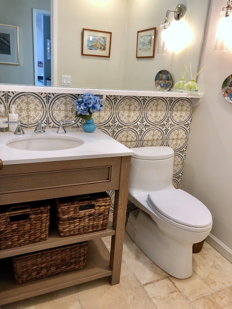 Inspiration for a small timeless blue tile and terra-cotta tile mosaic tile floor and beige floor powder room remodel in San Francisco with beaded inset cabinets, light wood cabinets, quartz countertops, white countertops, gray walls and an undermount sink
