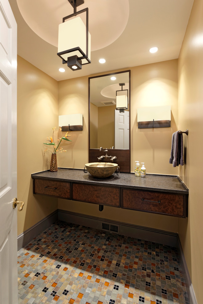 Small traditional cloakroom in DC Metro with flat-panel cabinets, multi-coloured tiles, mosaic tiles, yellow walls, mosaic tile flooring, dark wood cabinets, grey floors, a vessel sink and soapstone worktops.