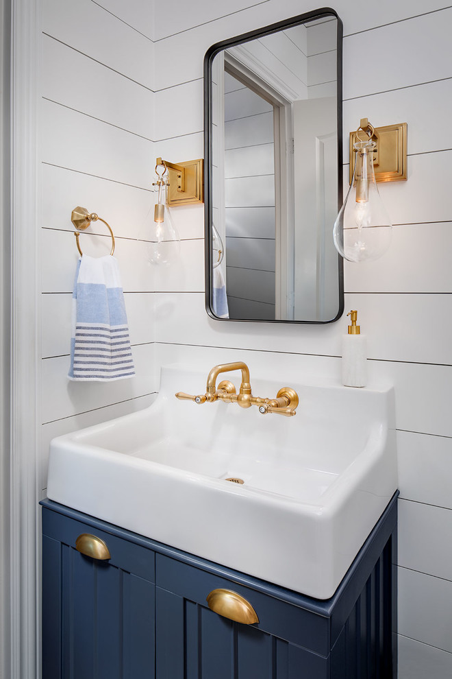 Design ideas for a small farmhouse cloakroom in San Diego with blue cabinets, white walls and ceramic flooring.