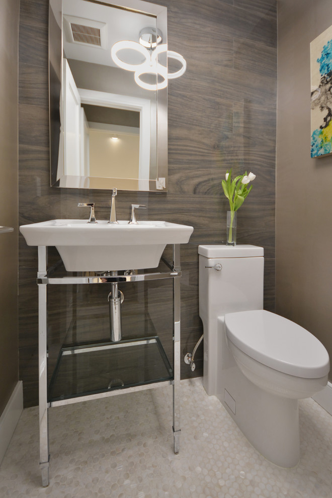 Small contemporary cloakroom in New York with a one-piece toilet, grey tiles and white floors.