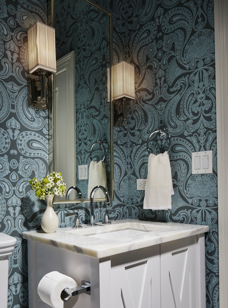 Mid-sized elegant white tile powder room photo in Chicago with white cabinets, blue walls and marble countertops