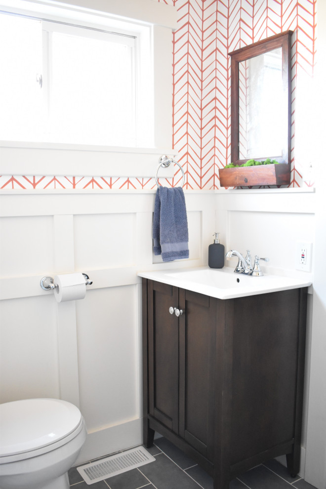 Small contemporary cloakroom in Denver with flat-panel cabinets, dark wood cabinets, a one-piece toilet, white tiles, orange walls, ceramic flooring, an integrated sink, concrete worktops, grey floors and white worktops.