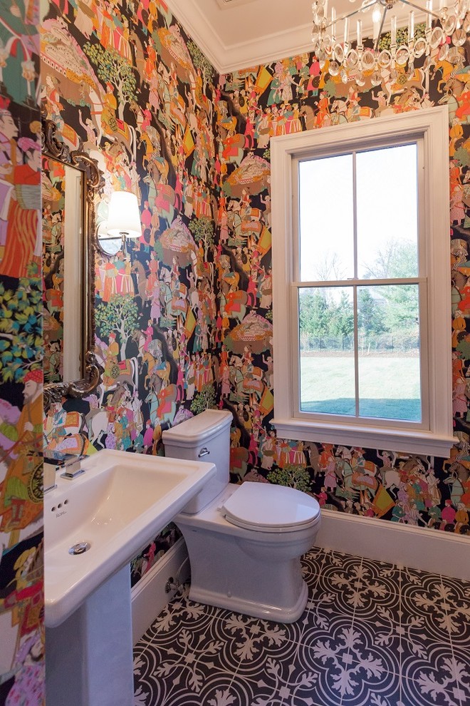 Inspiration for a cottage powder room remodel in DC Metro with a two-piece toilet, multicolored walls and a pedestal sink